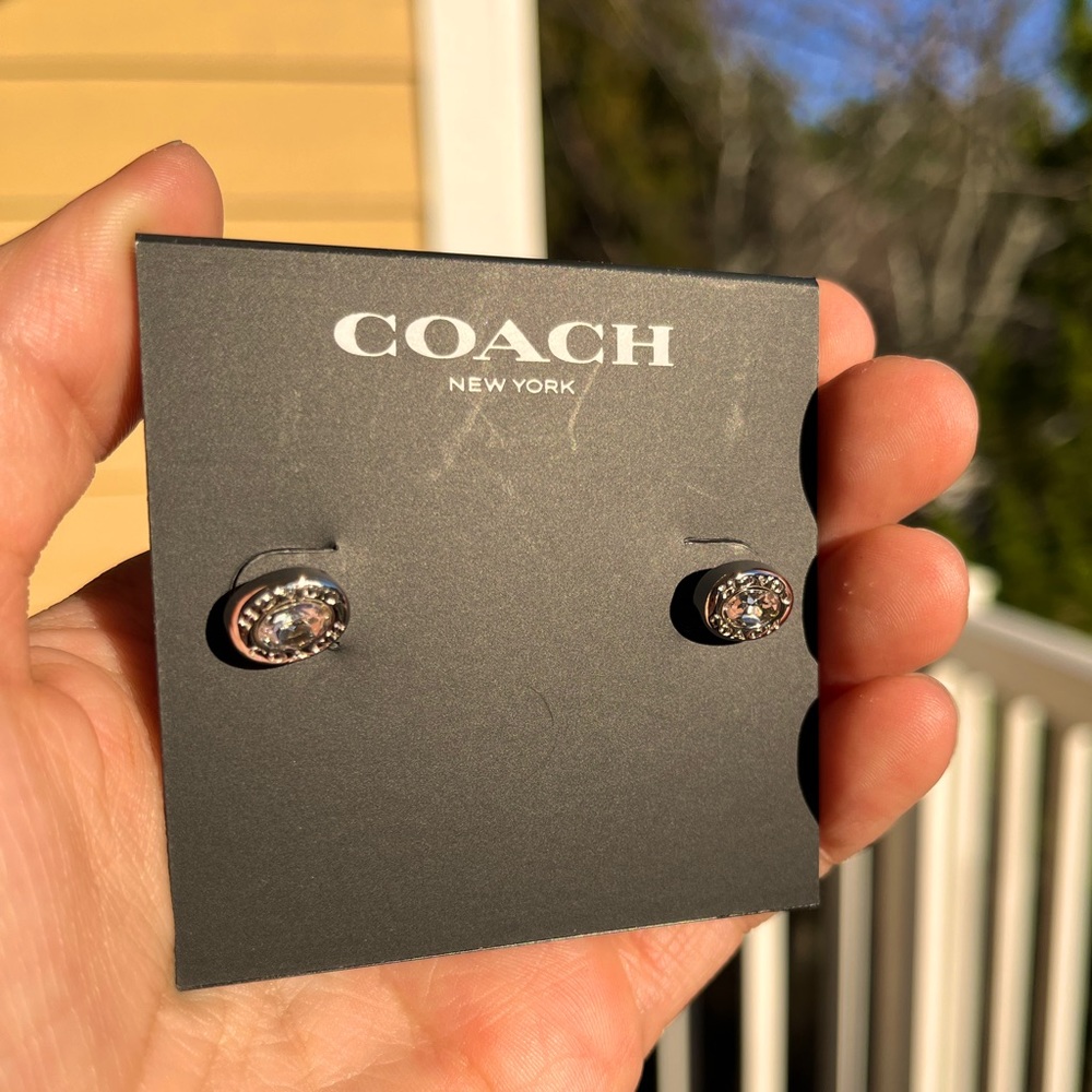 Never before worn Coach earrings! Tags still attached, original packaging.